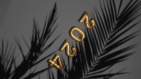 Golden-ballon-2024-new-year-Amidst-Silhouetted-Palms-verttical