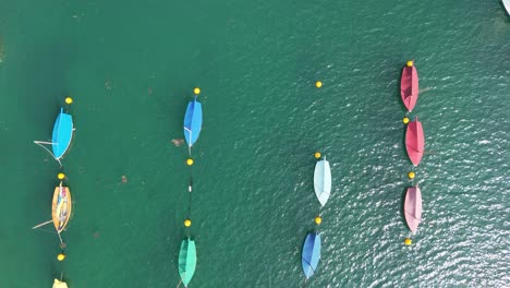 Top-down-view-from-drone-colourful-sailboats-moored