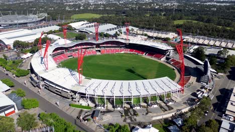 Drone-aerial-stadium-sports-arena-venue-show-ground-lighting-seating-tourism-baseball-football-pitch-grass-oval-Giants-home-ground-turf-Sydney-Olympic-Park-dome-Homebush-NSW-Australia-4K