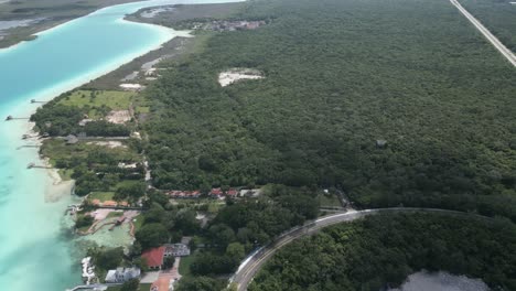 Seven-colours-lagoon-and-cenote-scenic-aerial-footage-of-Bacalar-mexico