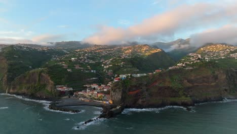 A-pink-blue-sky-reveals-the-small-town-of-Ponta-do-Sol-in-the-distance
