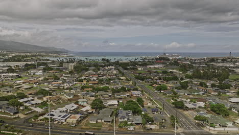 Kahului-Maui-Hawaii-Aerial-v6-flyover-town-center-along-Lono-Avenue-towards-harbor-capturing-townscape,-cruise-ship-at-Hobron-point-and-expansive-ocean-views---Shot-with-Mavic-3-Cine---December-2022
