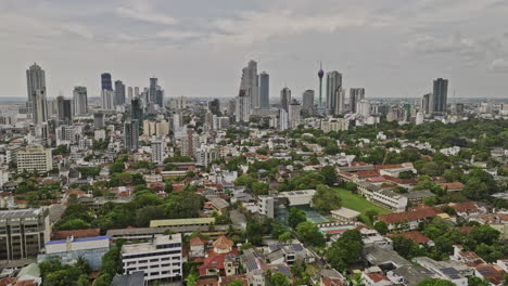 Colombo-Sri-Lanka-Aerial-v18-establishing-shot-low-drone-flyover-Kollupitiya-capturing-colonial-houses-and-urban-cityscape-across-downtown,-Wekanda-and-Area-02---Shot-with-Mavic-3-Cine---April-2023