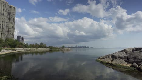 Panoramic-landscape-view-of-downtown-Toronto-and-Lake-Ontario,-on-a-calm-sunny-day