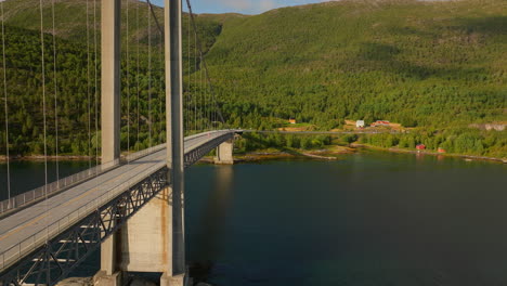 Drone-close-up-of-Kjerringstraumen-Bru-Bridge,-connection-across-Norwegian-fjord