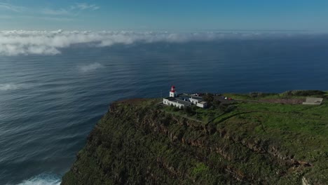 Ponto-do-Pargo-Lighthouse-with-light-clouds-at-sea,-high-altitude