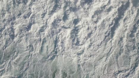 Top-View-Of-White-Foamy-Sea-Waves-Splashing-In-Summer