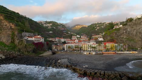 Zoomed-out-view-of-the-serene-town-of-Ponto-do-Sol-by-the-sea,-Madeira