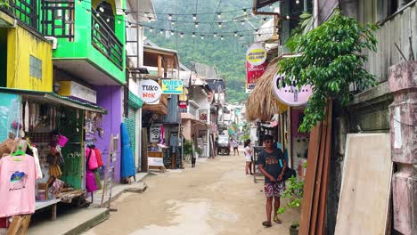 Colorful-streets-lined-with-tour-offices,-shops,-cafes-and-restaurants-in-El-Nido-of-Palawan,-Philippines,-Southeast-Asia