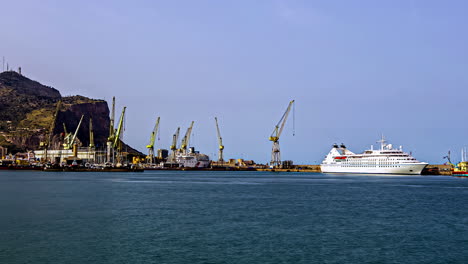 Sicilian-Harbor-Timelapse-with-Cranes-and-Cruise-Ship-Across-Bay