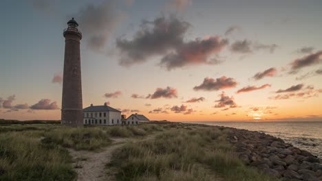 Skagen-Gray-Lighthouse-With-Sun-Rising-In-The-Horizon-During-Sunrise