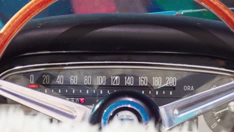 Vintage-speedometer-and-steering-wheel-of-a-classic-Lancia-car