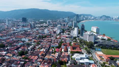 View-of-the-majestic-city-of-Penang-with-background-of-Penang-hill,-aerial