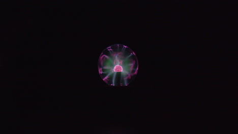 This-is-a-far-shot-video-of-a-plasma-globe-running-with-a-black-background