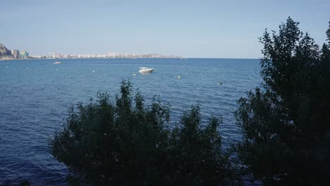 Boat-in-front-Alicante's-coast,-Costa-Blanca,-Spain,-Mediterranean