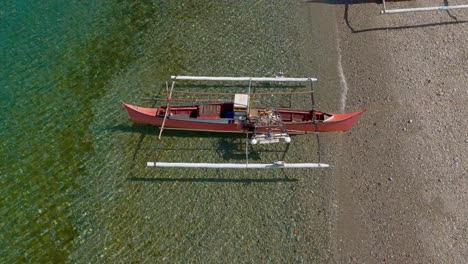 Overhead-Drone-View-of-Fishing-Boats-on-Bay-of-Ipil-Shore,-Philippines