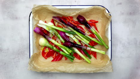 Tray-Of-Colourful-Vegetables-Being-Drizzled-With-Olive-Oil