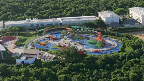BIg-children-pool-area-with-slides,-Nickelodeon-resort-Punta-Cana,-aerial-orbit