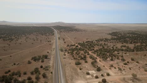 A-panoramic,-aerial-view-capturing-the-expanse-of-Route-66,-right-in-the-center