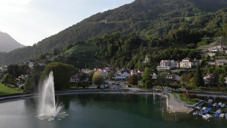 Beautiful-aerial-view-over-Weesen-town-based-near-shore-of-Walensee-lake,-Switzerland