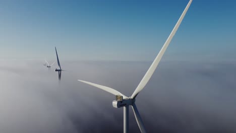 Wind-Turbines-Over-Foggy-Clouds---drone-static