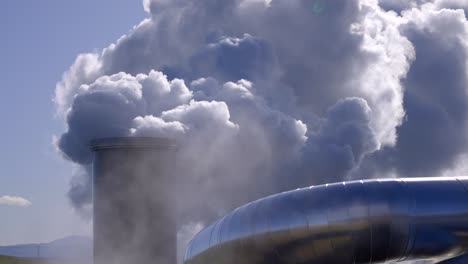 Carbon-emissions-to-the-atmosphere-from-industrial-pipes,-Industrial-steam-in-the-air