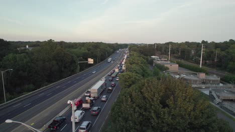 Drone-Shot-Tracking-Forward-over-Interstate,-Late-Afternoon-with-Heavy-Rush-Hour-Traffic