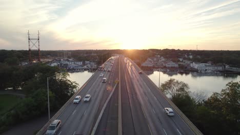 Drone-Shot-Tracking-Forward-over-Interstate-Median-at-Golden-Hour-with-Moderate-Traffic