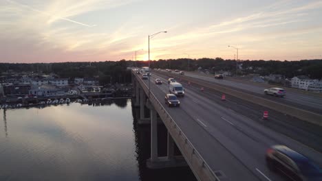Forward-Rising-Drone-Shot-of-Interstate-with-Cars-at-Sunset