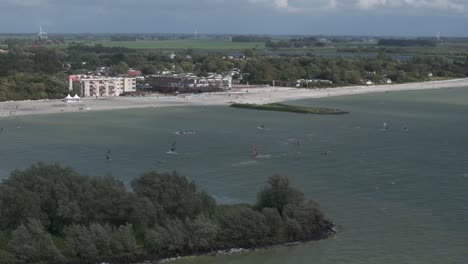 Wide-view-of-Makkum-beach-windsurf-spot-during-summer,-aerial