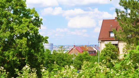rural-suburb-of-city-of-Stuttgart-with-lush-green-nature-and-big-gas-tank-in-background