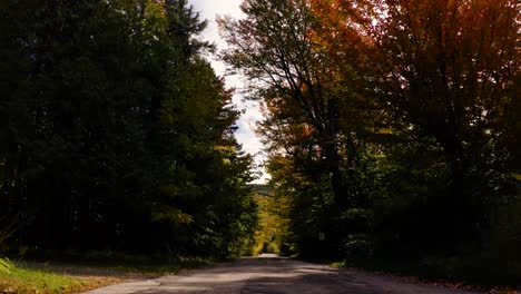 Aerial-Shot-Of-Rural-Country-Road-During-Peak-Fall-Foliage-Season