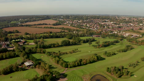 Aerial-shot-over-golf-course-towards-Epping-town