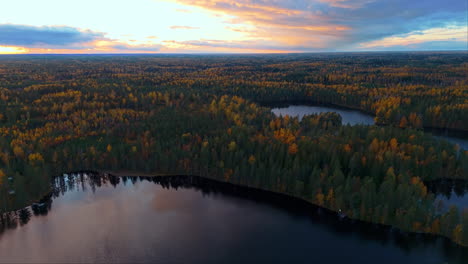 Sun-has-just-set-over-Fiskträsk-lake-in-Sipoonkorpi-National-Park,-Finland