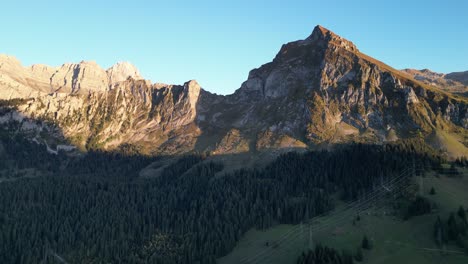 Panoramic-view-of-Obersee-Fronalpstock-Glarus-Näfels,-rocky-mountains-with-blue-sky-and-golden-light