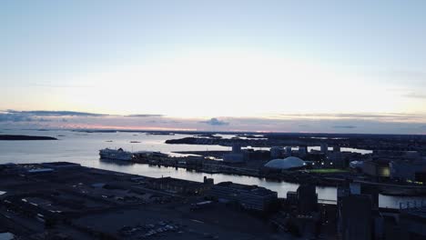 Low-evening-flyover-of-shipping-piers-of-Helsinki-Finland-waterfront