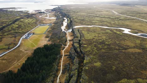 Drone-flying-over-a-beautiful-canyon-in-Thingvellir-national-park-in-Iceland-on-a-sunny-day