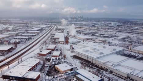 An-aerial-view-of-Calgary-Downtown-with-an-epic-sky-in-the-background,-captured-from-the-industrial-area