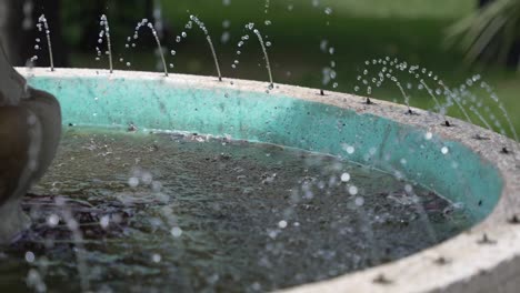 Close-up-of-water-jets-in-a-turquoise-fountain-basin
