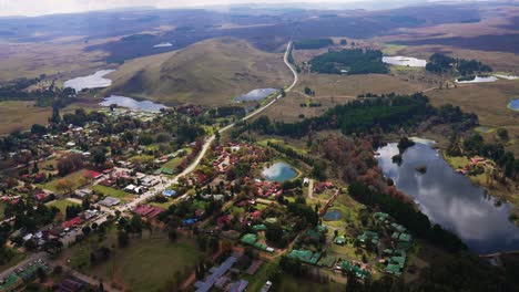 Aerial-shot-of-a-small-town-in-South-Africa-with-a-beautiful-landscape