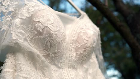 Close-up-view-of-the-bride's-wedding-white-dress-with-lace