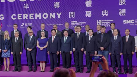 Group-of-business-people-participating-in-opening-ceremony-of-Semicon-Taiwan,-Closeup
