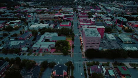 Twilight-view-Columbus,-Georgia:-vibrant-cityscape,-illuminated-streets---Aerial