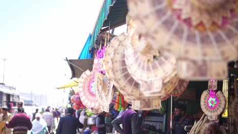 Garlands-made-out-of-India-Rupees-notes,-used-as-gifts-during-weddings-and-other-functions,-displayed-for-sale-in-local-market-in-Srinagar,-Kashmir-India