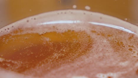 Detail-view-of-a-beer-in-the-upper-area-where-the-protective-foam-protects-it-from-spoiling