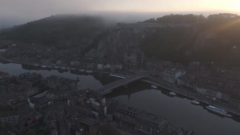 Wide-view-of-famous-Dinant-city-near-meuse-river,-aerial
