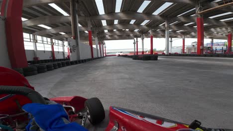 Go-Kart-pilot-point-of-view-racing-on-indoor-and-outdoor-track-of-kartdrome
