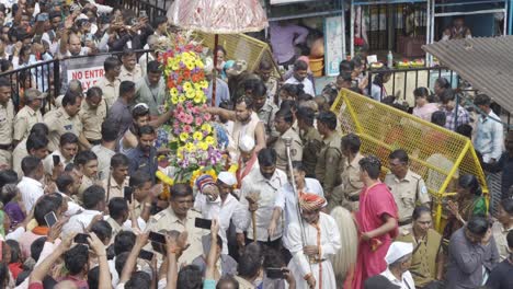 The-crowd-of-Hindu-devotees-and-priests-carrying-the-main-statue-of-Trimbkeshwar-god-palanquin-dedicated-to-Lord-Shiva-during-the-holy-month-of-Shravana
