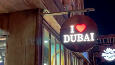 Neon-sign-I-Love-Dubai-in-Dubai,-United-Arab-Emirates-4K