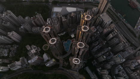 Residential-High-Rise-Buildings-in-Dense-Urban-Development,-With-Pool,-The-Belcher's,-Sai-Wan,-Hong-Kong-Island,-Cinematic-Top-Down-Aerial